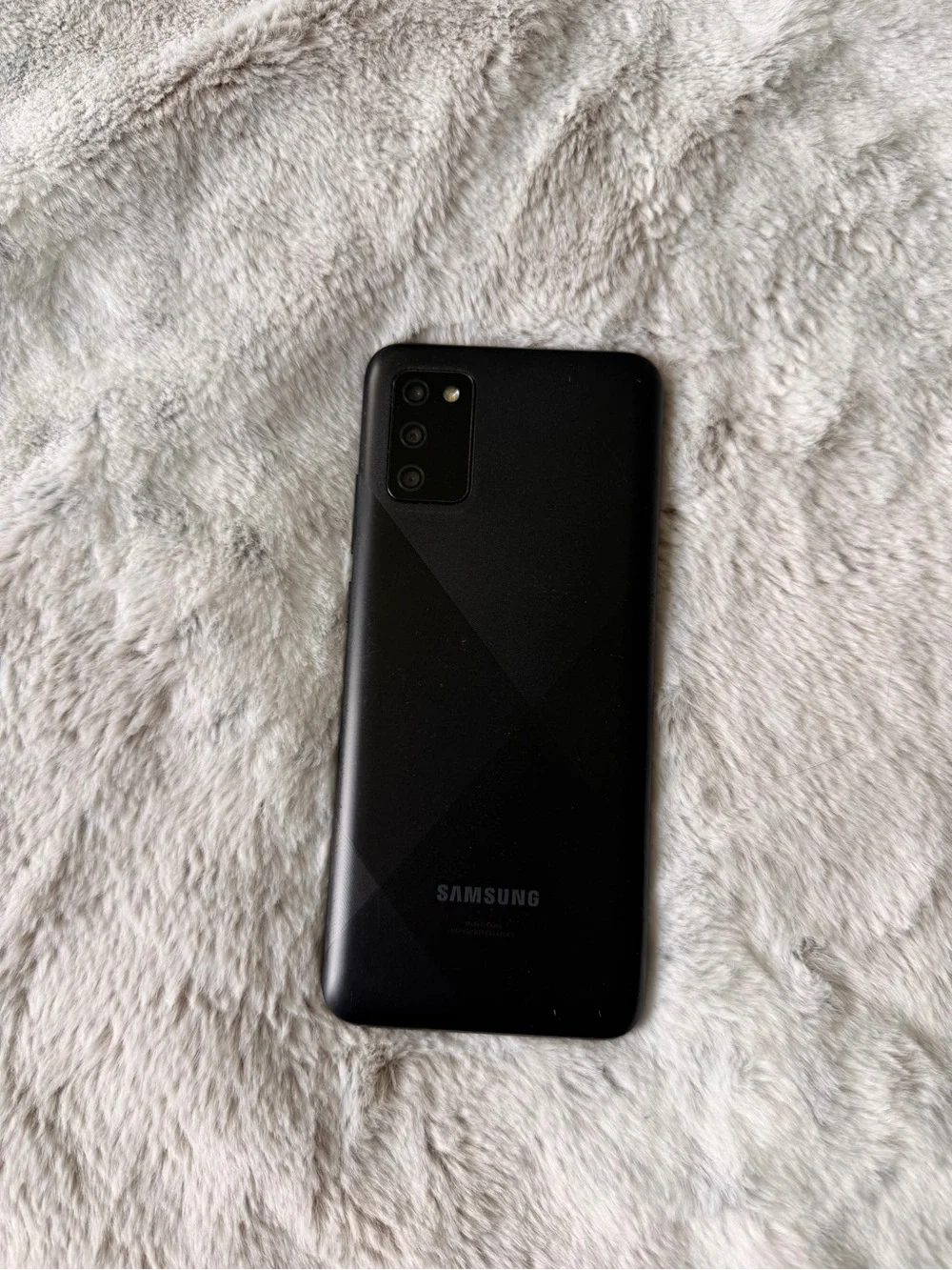 Samsung Black Smartphone with Blue Start Screen
